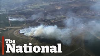Alberta wildfires force thousands from their homes