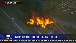 Cars burn on Brooklyn Bridge