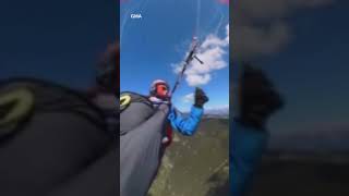 Video shows the terrifying moment a paraglider was struck by a plane