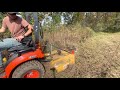 Brush hogging a dry detention basin with my kubota bx23s