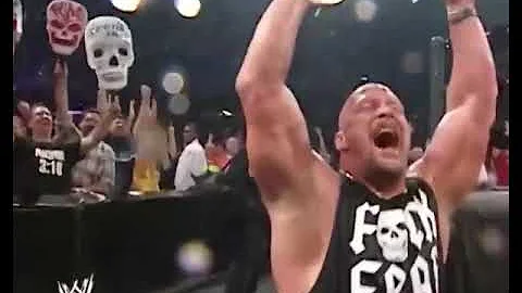 Stone Cold Steve Austin rolls down the ramp in an office chair