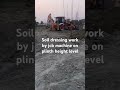 Soil dressing work by jcb machine on plinth height level of a building