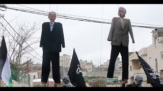 Palestinian refugees burn effigies of Trump and Pence to protest aid cuts