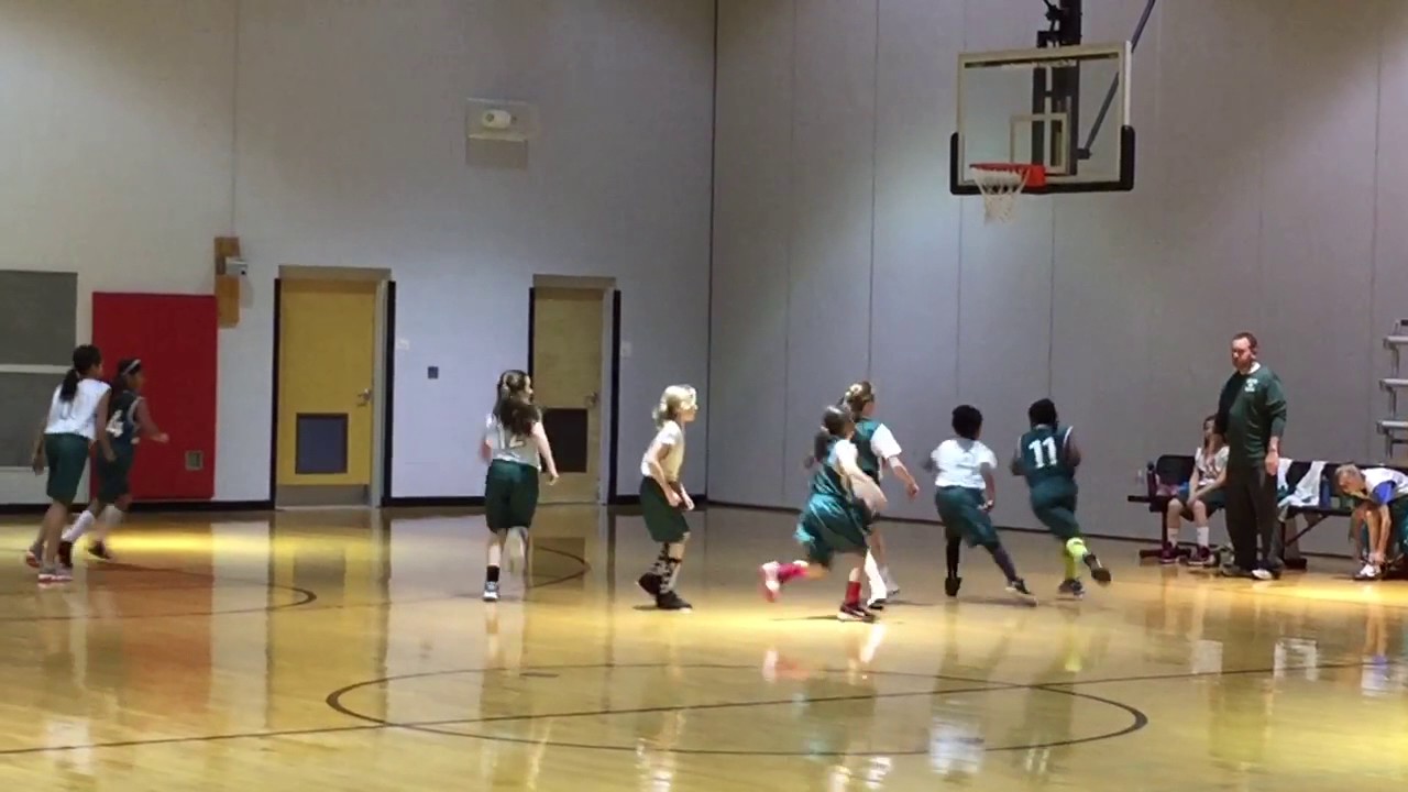 9yr old Tacoya Heyward takes it to the hoop
