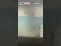 Landspout Swirls Amid Field Of Windmills