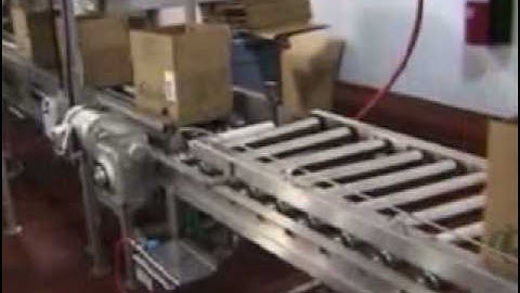 Label Printer Applicator applies labels to the front panel of a box