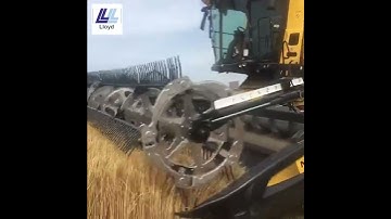 This New Holland CR9.90 combine harvester with a MacDon FD235 Flex Draper header is out at work.