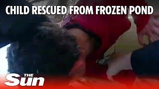 Heroic moment police officer rescues child from frozen pond