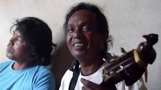 We visited uttam's house in the village and took a rest before eating,
but to my surprise, basuded started playing his dotara singing while
uttam played ...