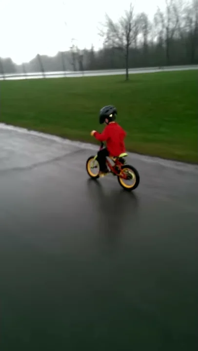 Isaac in his first rainy ride