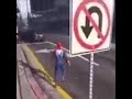 Spider man riding bike hits sign