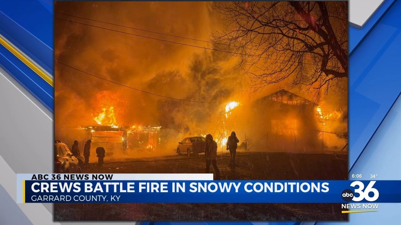 Crews battle house fire in snowy conditions - YouTube
