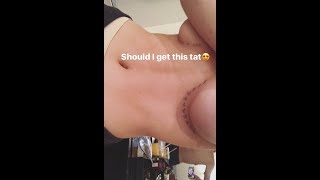 Bella Thorne strips topless to reveal daring underboob inking