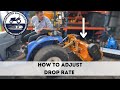 How to adjust the drop rate on a compact tractor