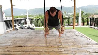 Exercise Library / Gymnastic Rings - Archer Push-ups
