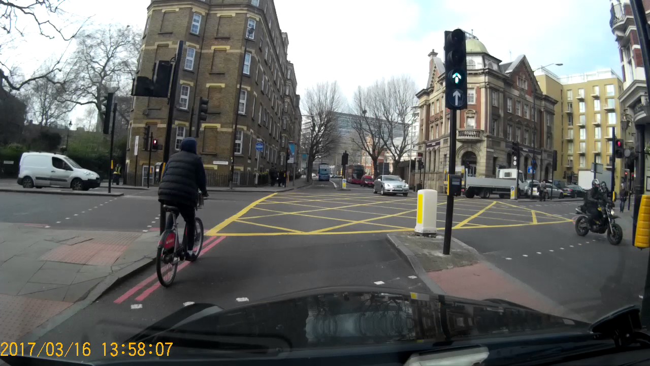 Cyclist having to do a stoppie after running red light - YouTube