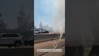 Driving Past LA Fire Next To Freeway