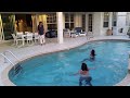Jumping in pool with clothes on