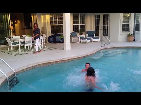 Jumping in pool with clothes on