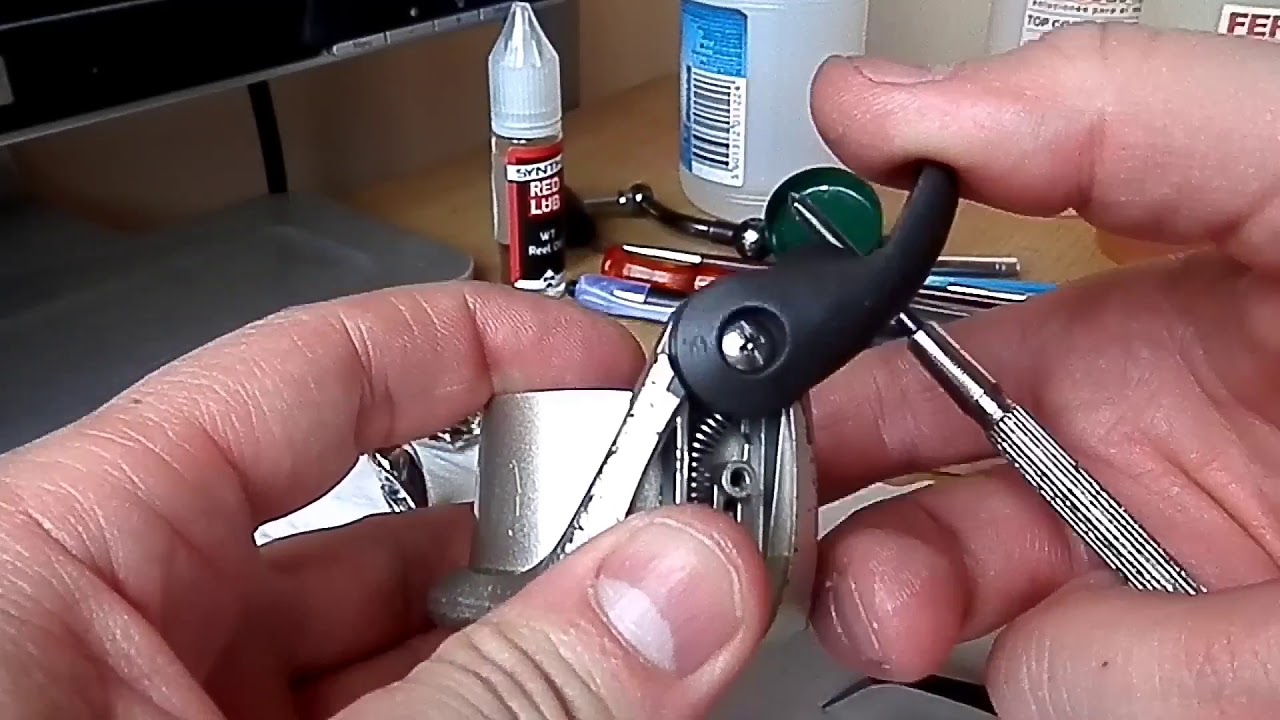 Montar mola da asa num carreto shimano