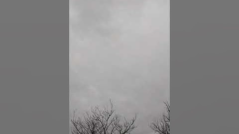 Dark Skies and White pulsating light behind the clouds?