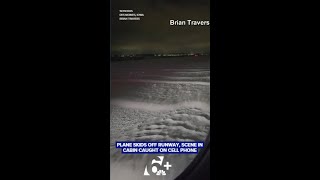 Plane skids off a runway in snowy conditions.  What happened inside was all caught on camera
