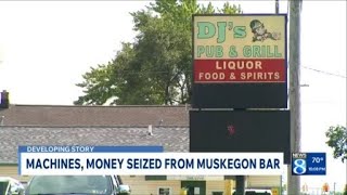 Machines money seized from Muskegon bar suspected of illegal gambling activity
