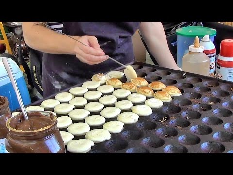 London Street Food. Cooking Sweet Dutch Pancakes "poffertjes" in Camden Lock Market