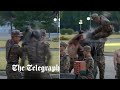 North Korea: Troops break bricks with bare hands in bizarre show of force