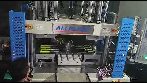 Center turret two color vertical injection machine by ALLPLAST
