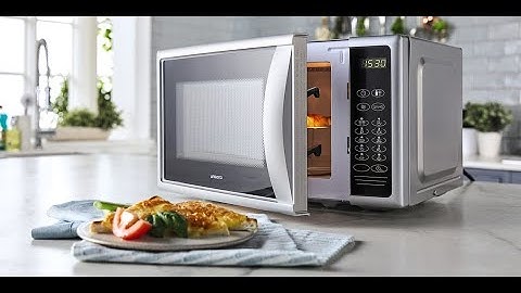 Microwave warming food with beep sounds at the end