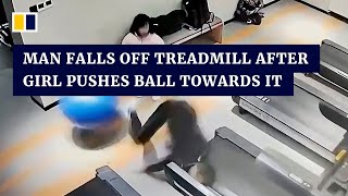 Man in China falls off treadmill after girl pushes exercise ball towards it