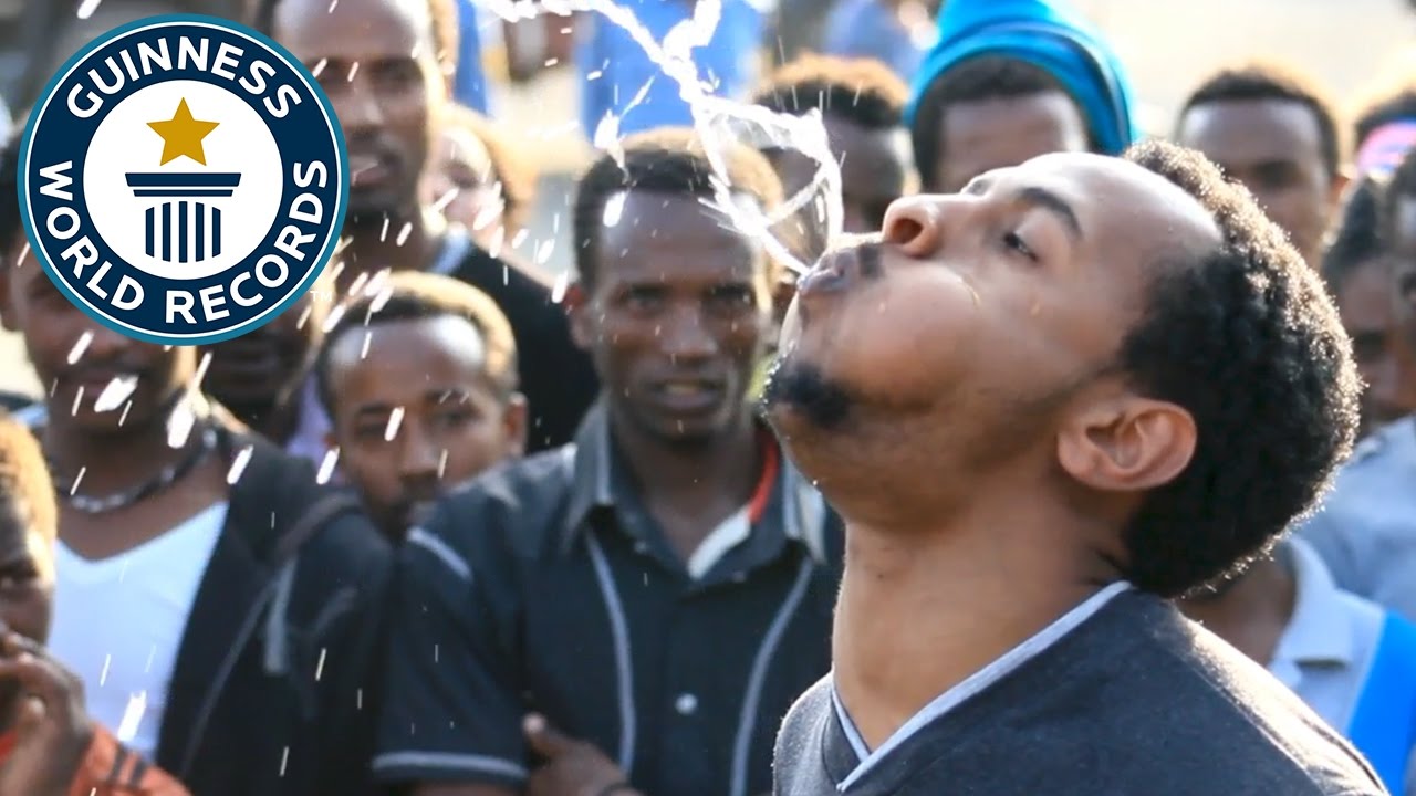 ⁣Longest time to spray water from the mouth - Guinness World Records