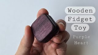 Wooden fidget toy made from an exotic wood called Purple Heart