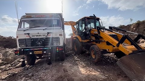 Jcb 3dx backhoe murum loading in tata tipper 1618 l mud loading tata tipper 1618