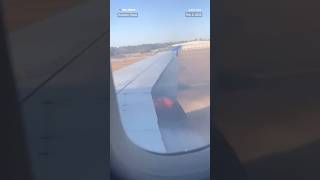A video shows a United Airlines flight with flames coming from under the wing of the plane.