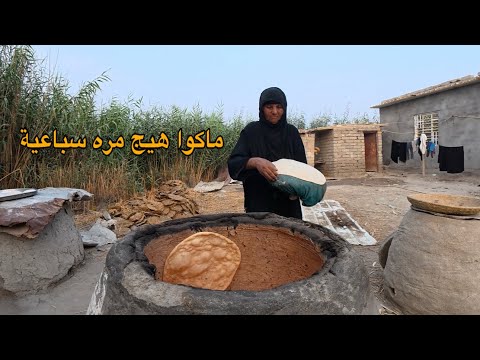 صدق أو لا تصدق هاي المرأة تمتلك سرعة مو طبيعية أثناء خبز العجين باستخدام التنور الطيني