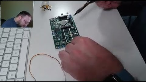 Raker solders an RF shield on a HackRF