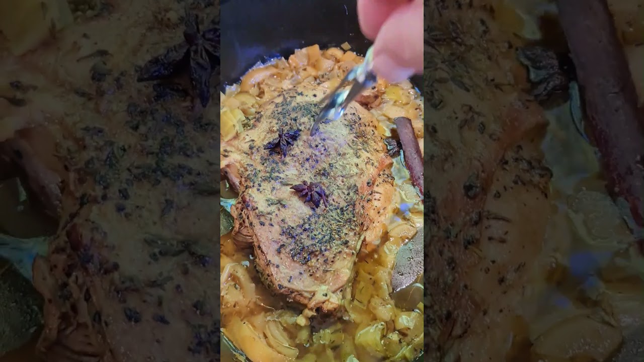 Checking the tenderness of a slow cooked (3 hours) wild (feral) goat leg 