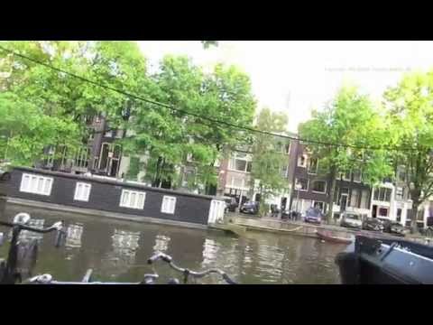Walk past the Amsterdam Coffee Shops and along the Singel Canal in Holland Walk past the Amsterdam Coffee Shops and along the Singel Canal in Holland