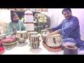 Legend Tabla player of ajrada gharana ustad Akram khan enjoying tabla at Ustad QKN Tabla making shop