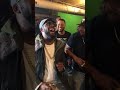 R. Kelly having a friendly sing-off with Slique Jay Adams