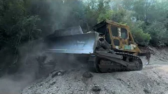 Grading a forest road in challenging terrain; the power of a #komatsu #dozer