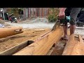 Live I Woodworking : Carpenters punch holes in wooden house columns.