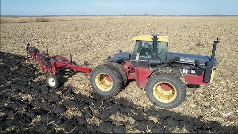 Plowing a harvested corn field with a Versatile 936 tractor and Salford Plow