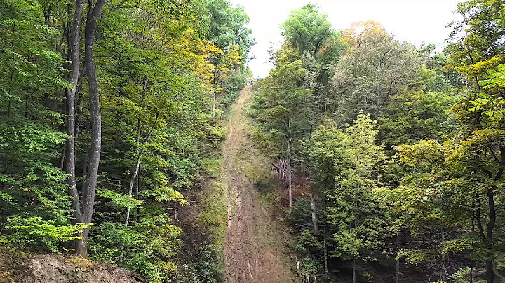 Workman climbing greasy at 5 points wv