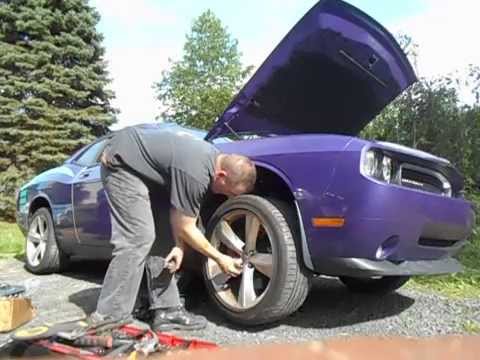 How to install front brakes and rotors on a 2010 Dodge Challenger SRT8 Part 1