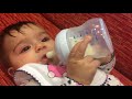 Liana 4 months cute baby girls holding milk bottle Liana