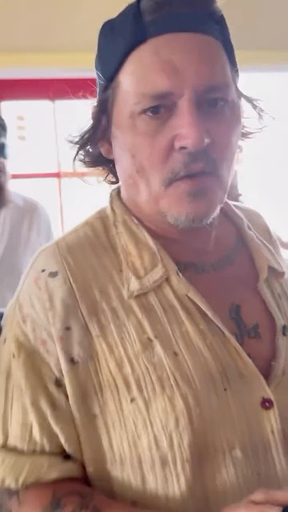 Johnny Depp drinking Rum at a local Café in the Caribbean