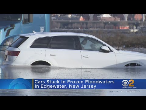 Cars remain stuck in frozen parking lot in Edgewater, N.J.